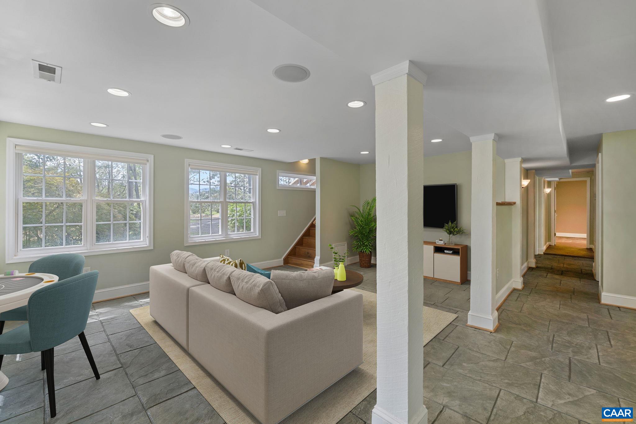 8508 Dick Woods Road Afton, VA 22920 - Photo 32 of 55 a living room with furniture and a flat screen tv