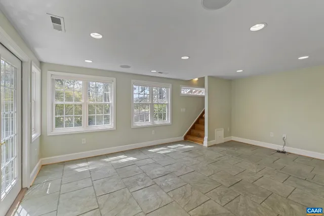 a bathroom with a toilet sink a shower and a mirror