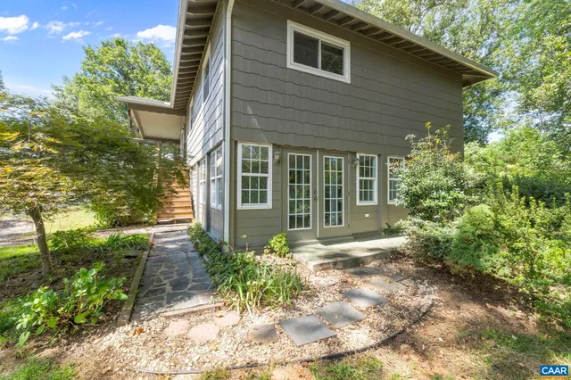 a backyard of a house with lots of green space