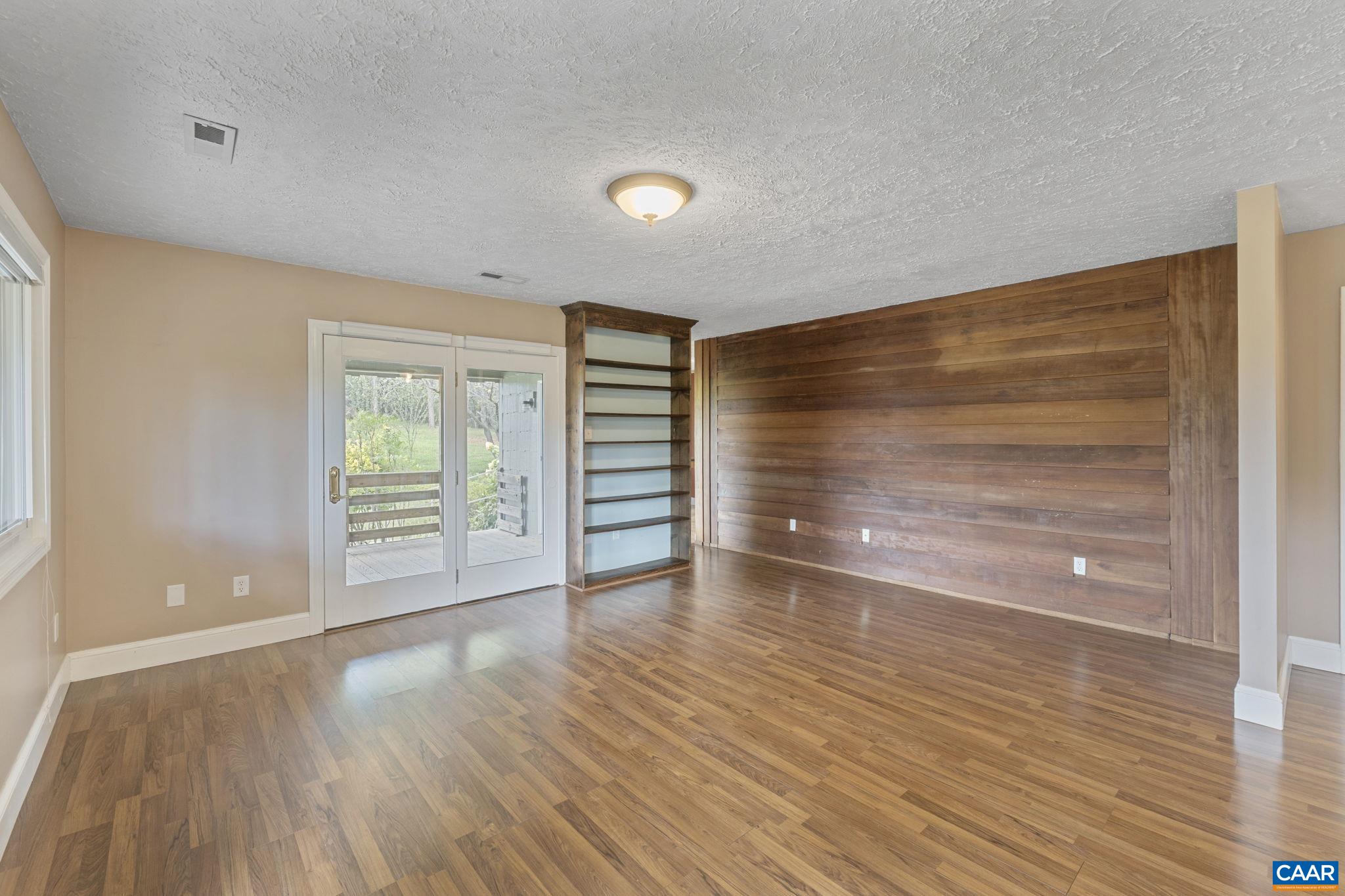 8508 Dick Woods Road Afton, VA 22920 - Photo 9 of 55 wooden floor in an empty room with a window