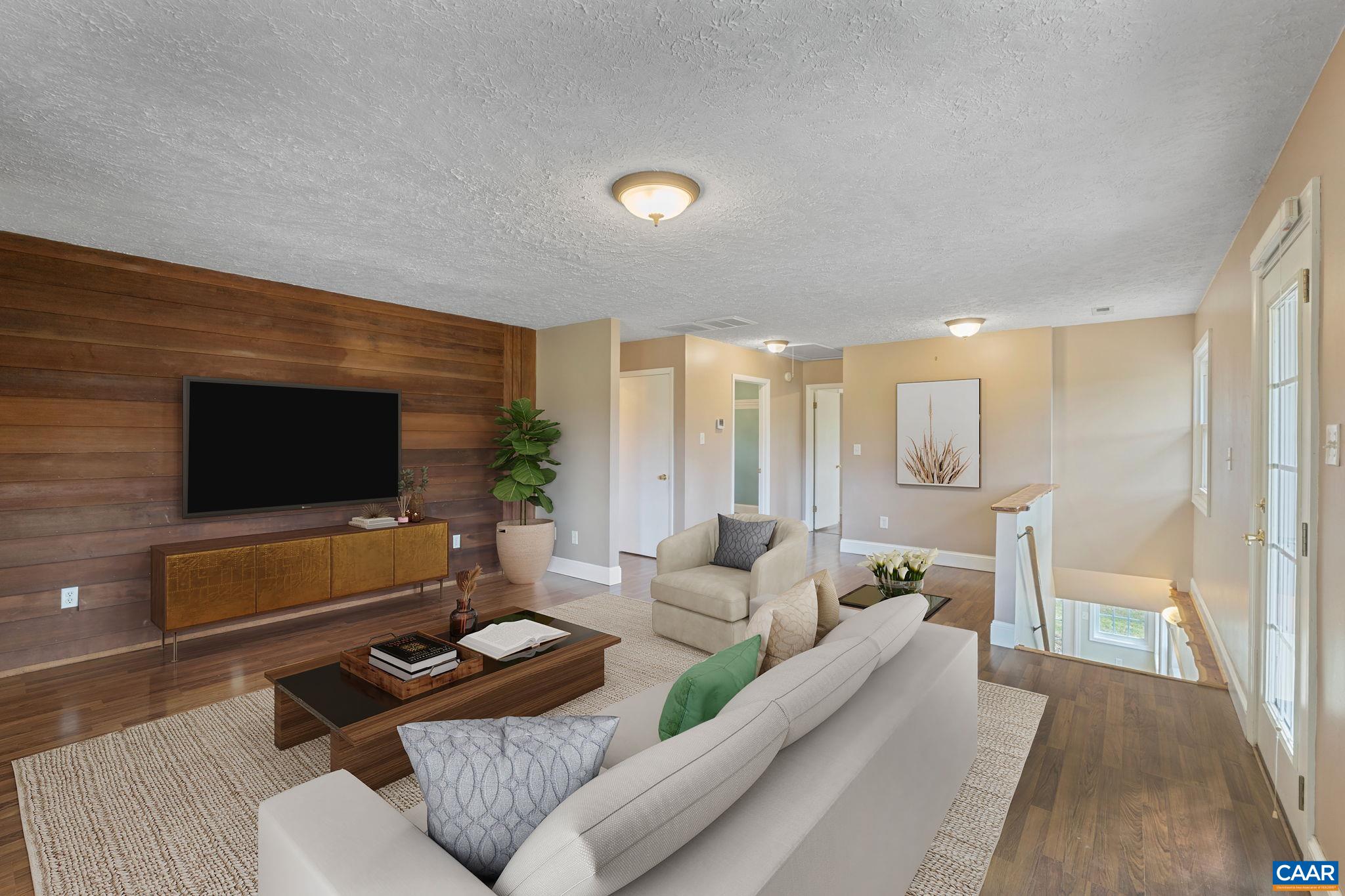 8508 Dick Woods Road Afton, VA 22920 - Photo 10 of 55 a living room with furniture and a flat screen tv