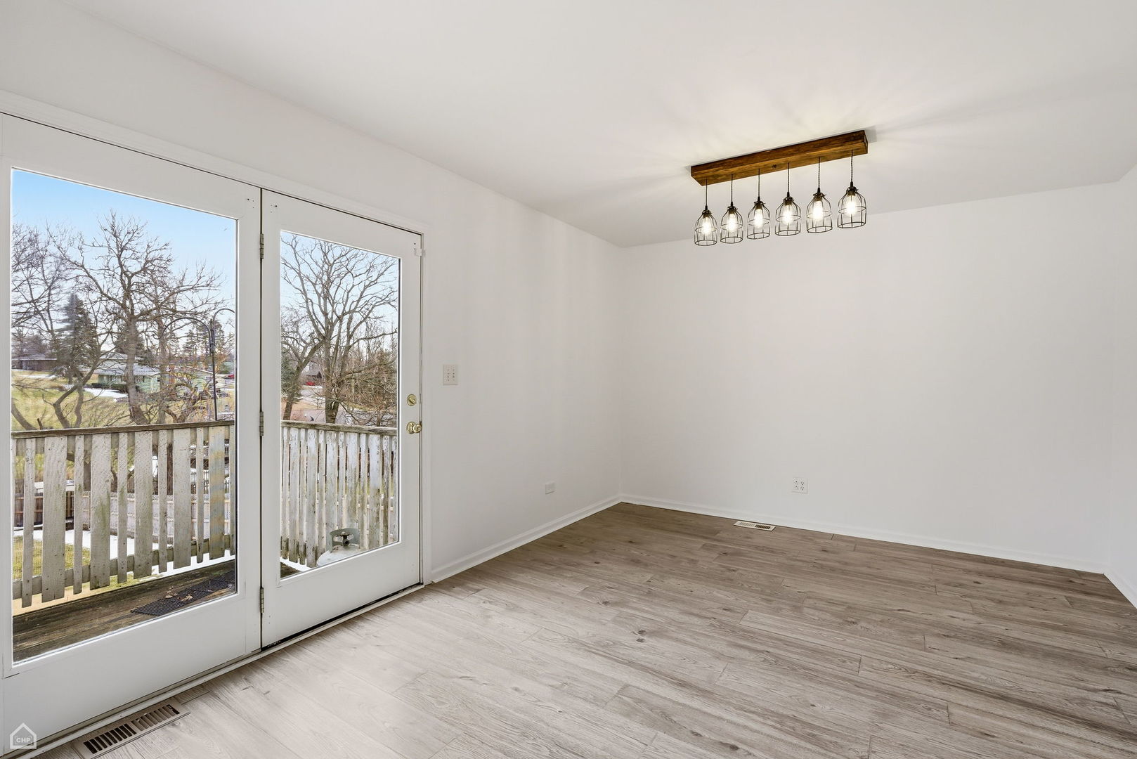 27071 North Ridge Street Wauconda, IL 60084 - Photo 12 of 36 a view of a room with wooden floor and windows