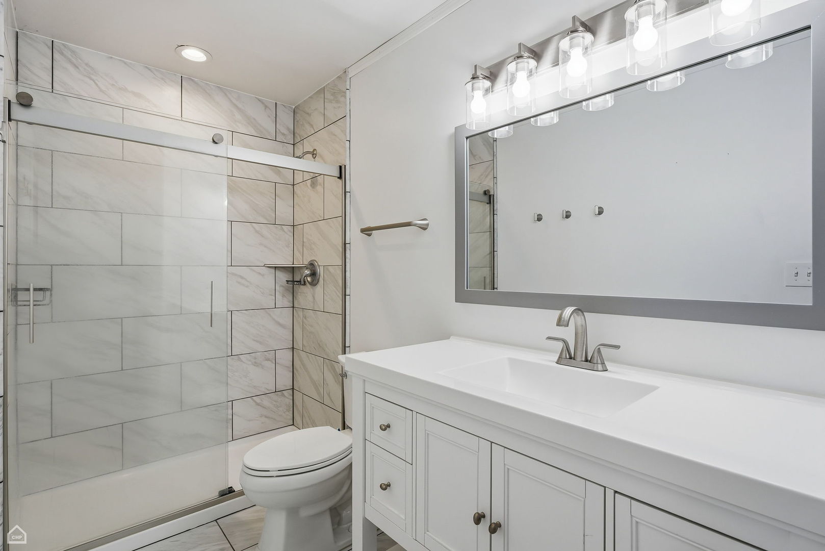 27071 North Ridge Street Wauconda, IL 60084 - Photo 19 of 36 a bathroom with a sink a toilet and shower