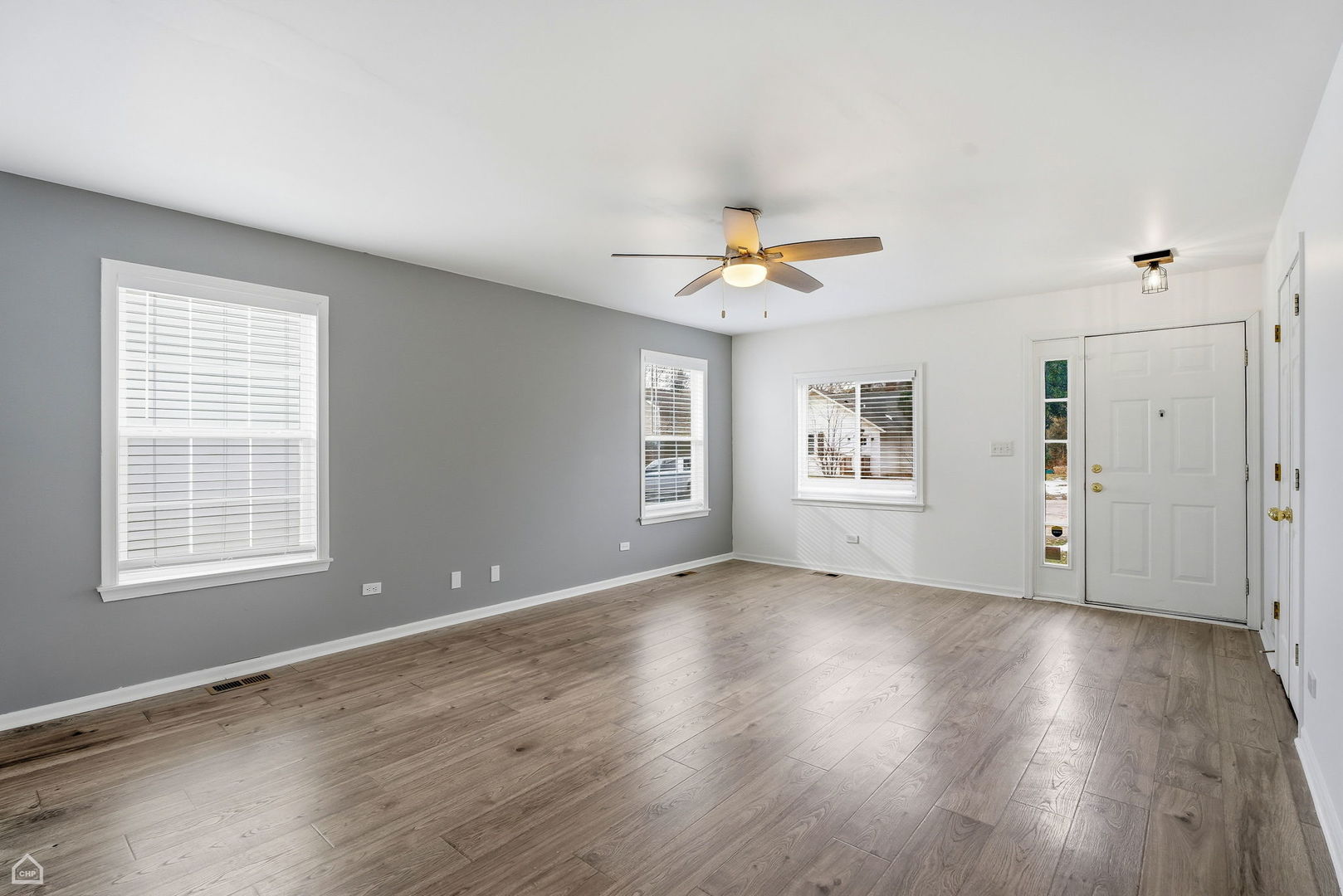 27071 North Ridge Street Wauconda, IL 60084 - Photo 2 of 36 an empty room with wooden floor and windows