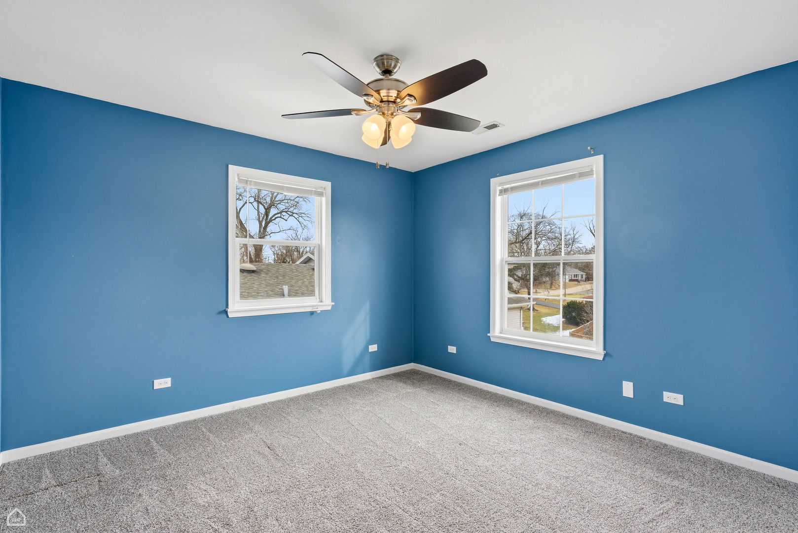 27071 North Ridge Street Wauconda, IL 60084 - Photo 22 of 36 an empty room with window and ceiling fan