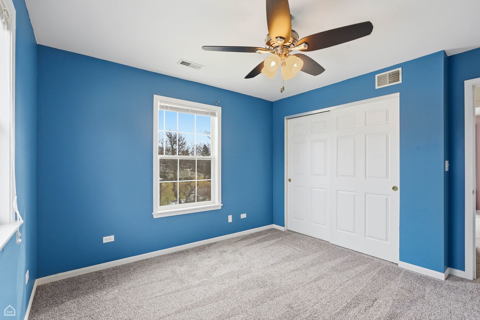 27071 North Ridge Street Wauconda, IL 60084 - Photo 23 of 36 an empty room with windows and fan