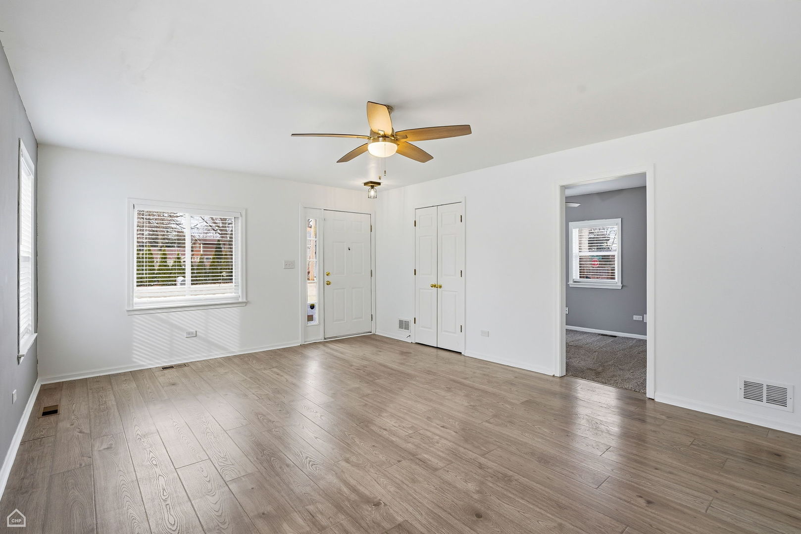 27071 North Ridge Street Wauconda, IL 60084 - Photo 3 of 36 a view of an empty room with window and wooden floor