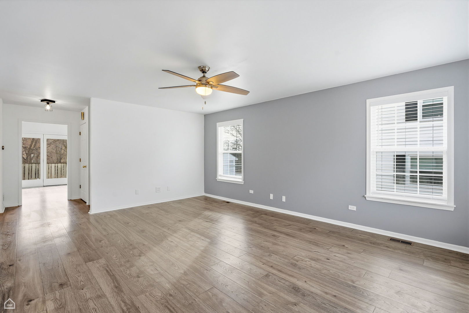 27071 North Ridge Street Wauconda, IL 60084 - Photo 4 of 36 a view of an empty room with a window and wooden floor