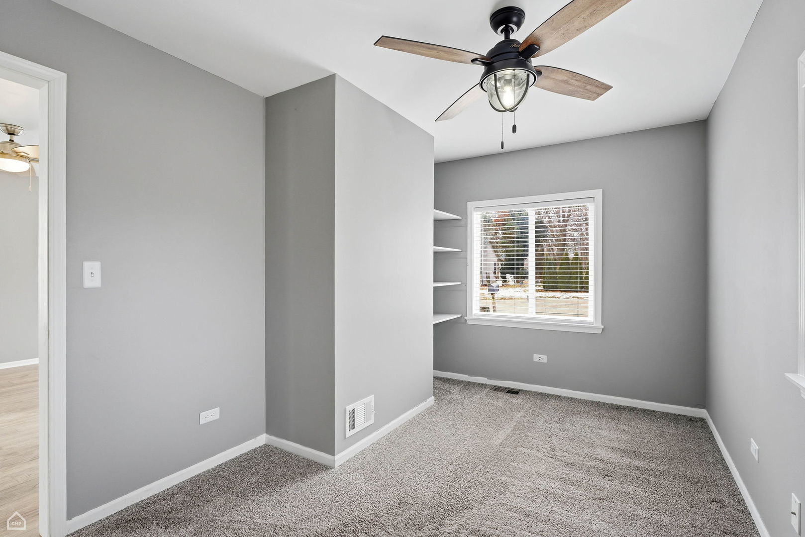 27071 North Ridge Street Wauconda, IL 60084 - Photo 6 of 36 a view of an empty room with a window