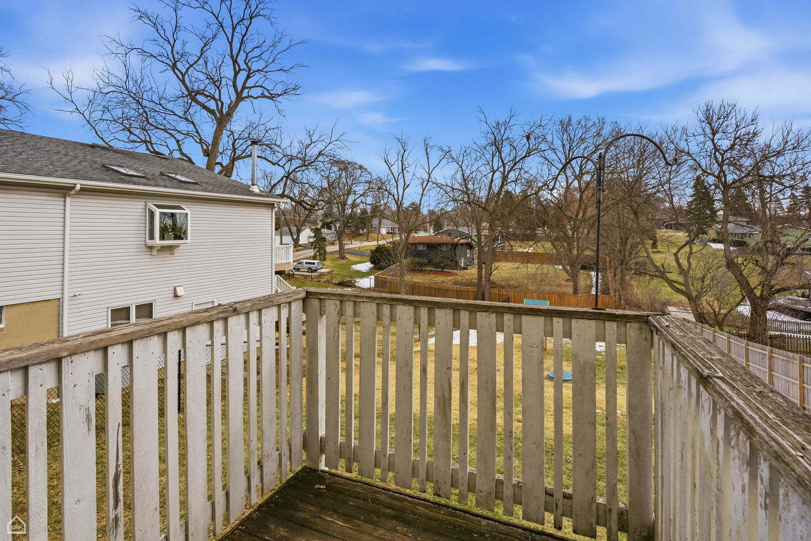 27071 North Ridge Street Wauconda, IL 60084 - Photo 8 of 36 a view of a balcony with trees