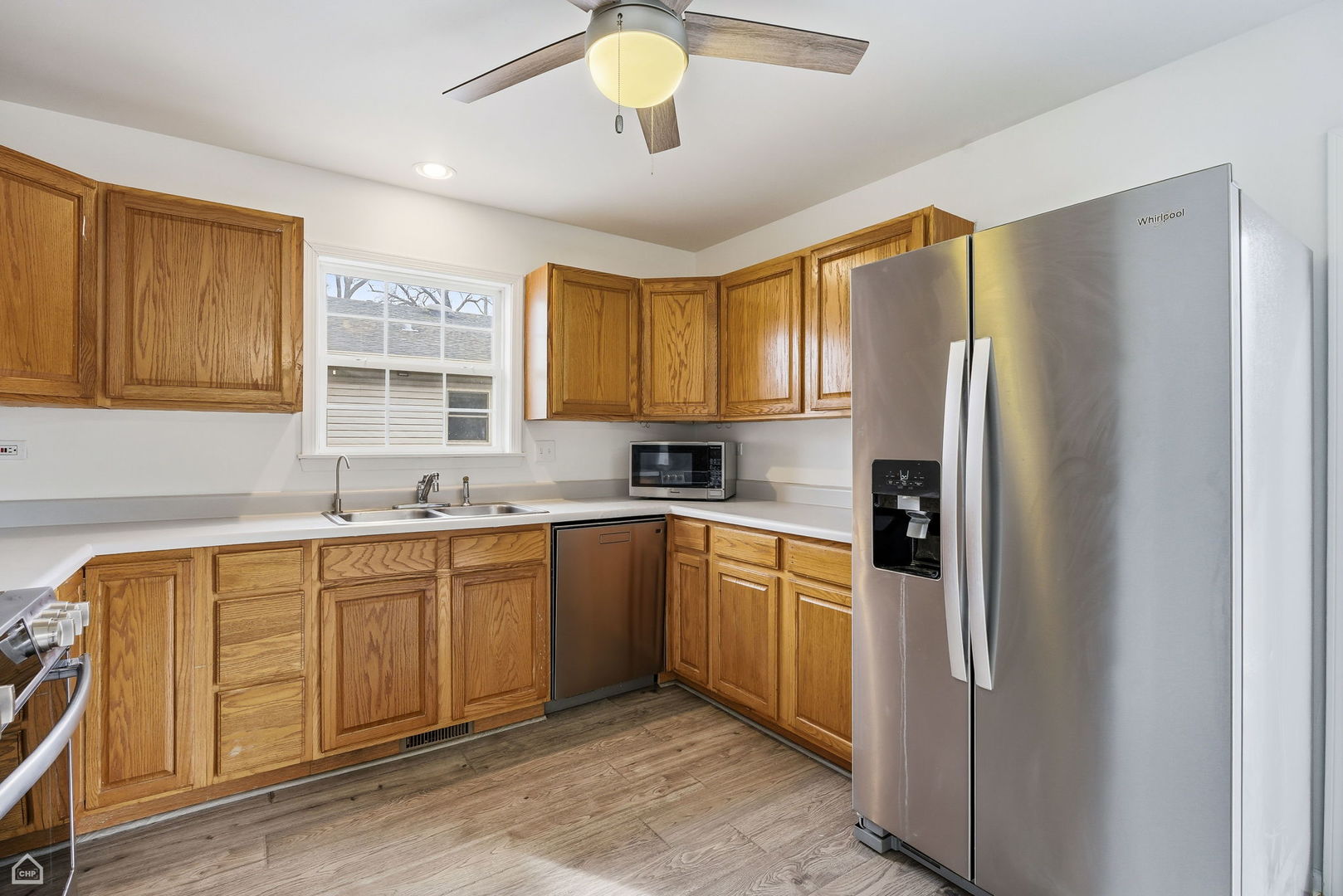 27071 North Ridge Street Wauconda, IL 60084 - Photo 10 of 36 a kitchen with stainless steel appliances granite countertop a refrigerator and a sink