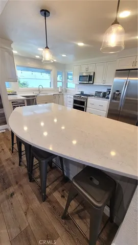 a stove top oven sitting inside of a kitchen