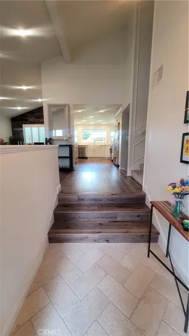 a living room with furniture fireplace and flat screen tv