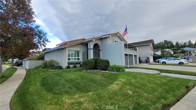 a front view of house with yard and green space