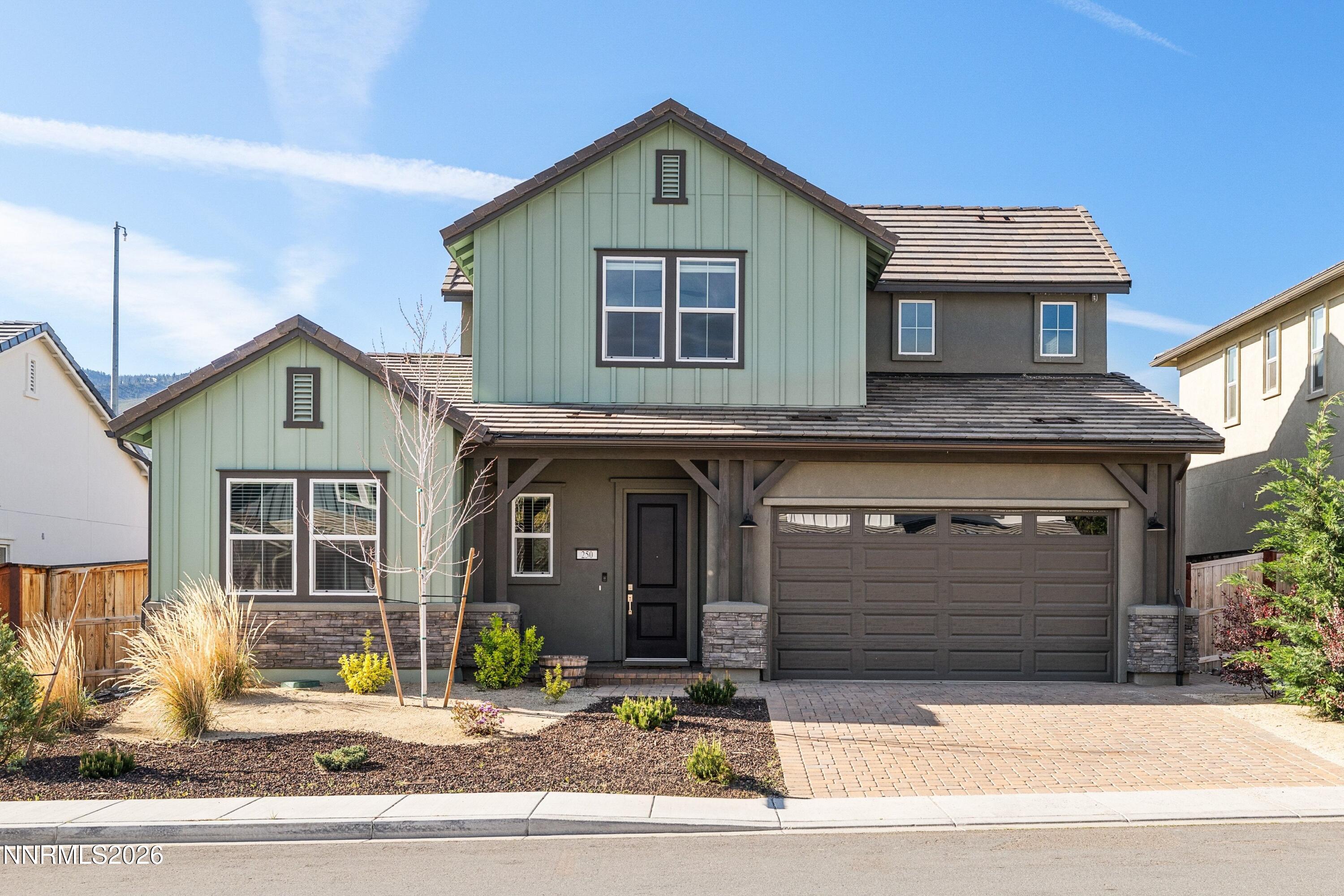 250 Commodore Drive Verdi, NV 89439 - Photo 2 of 49 a front view of a house with a garage and windows