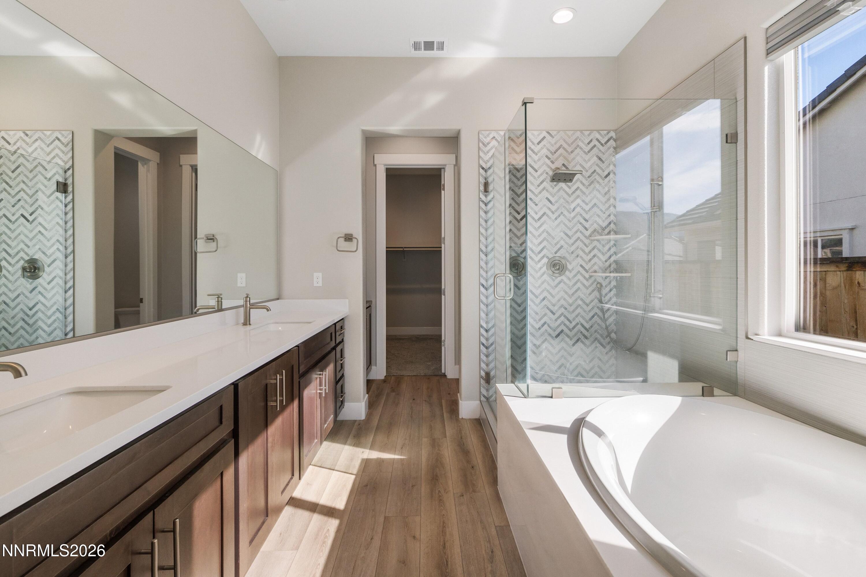 250 Commodore Drive Verdi, NV 89439 - Photo 21 of 49 a spacious bathroom with a tub sink shower and a mirror