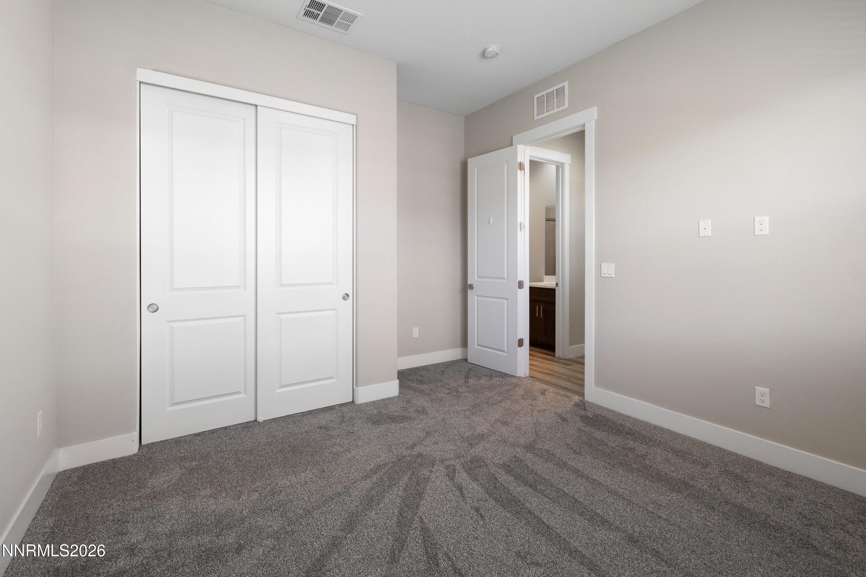 250 Commodore Drive Verdi, NV 89439 - Photo 31 of 49 a view of an empty room with closet and wooden floor