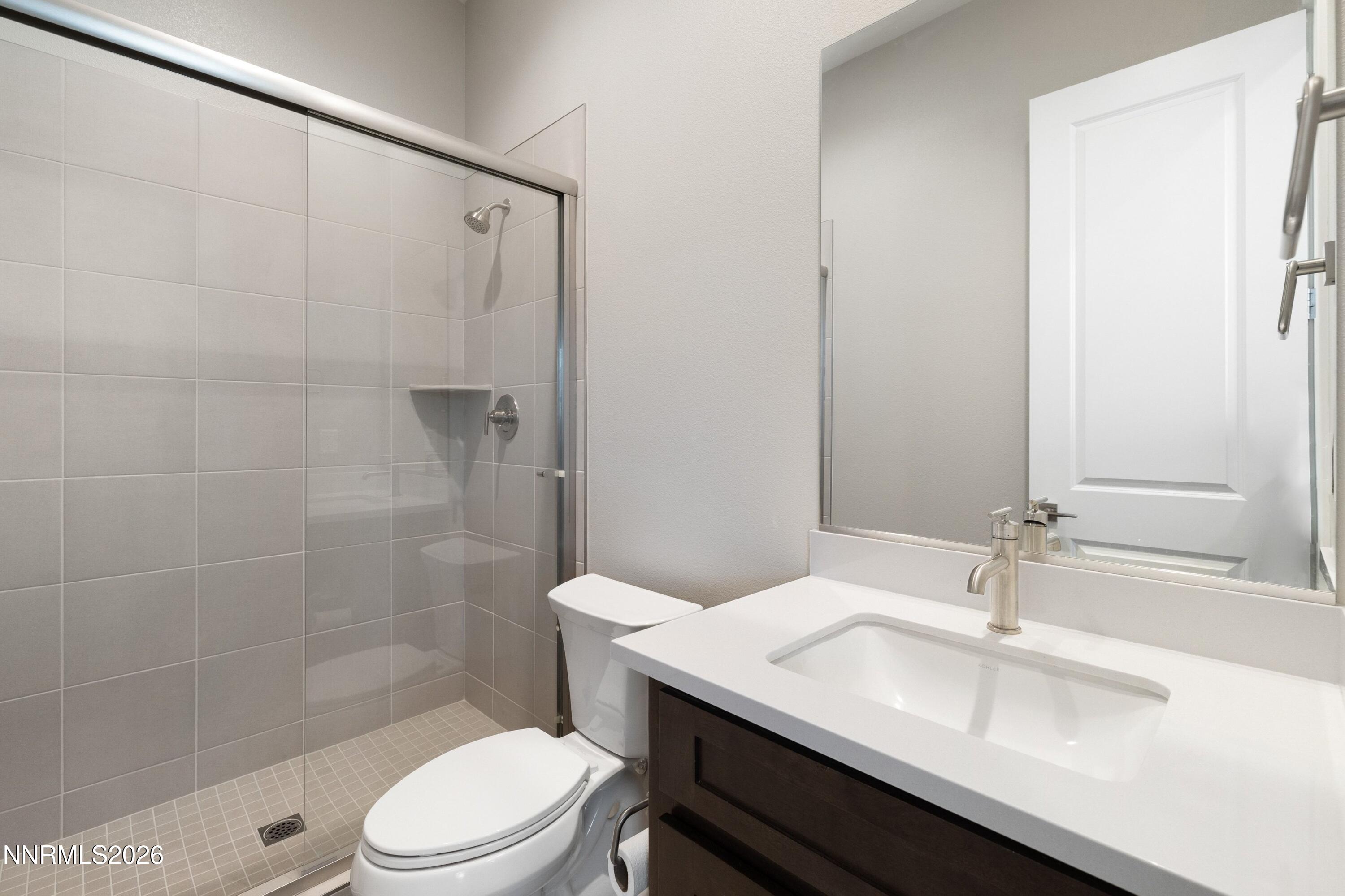 250 Commodore Drive Verdi, NV 89439 - Photo 32 of 49 a bathroom with a sink toilet and shower