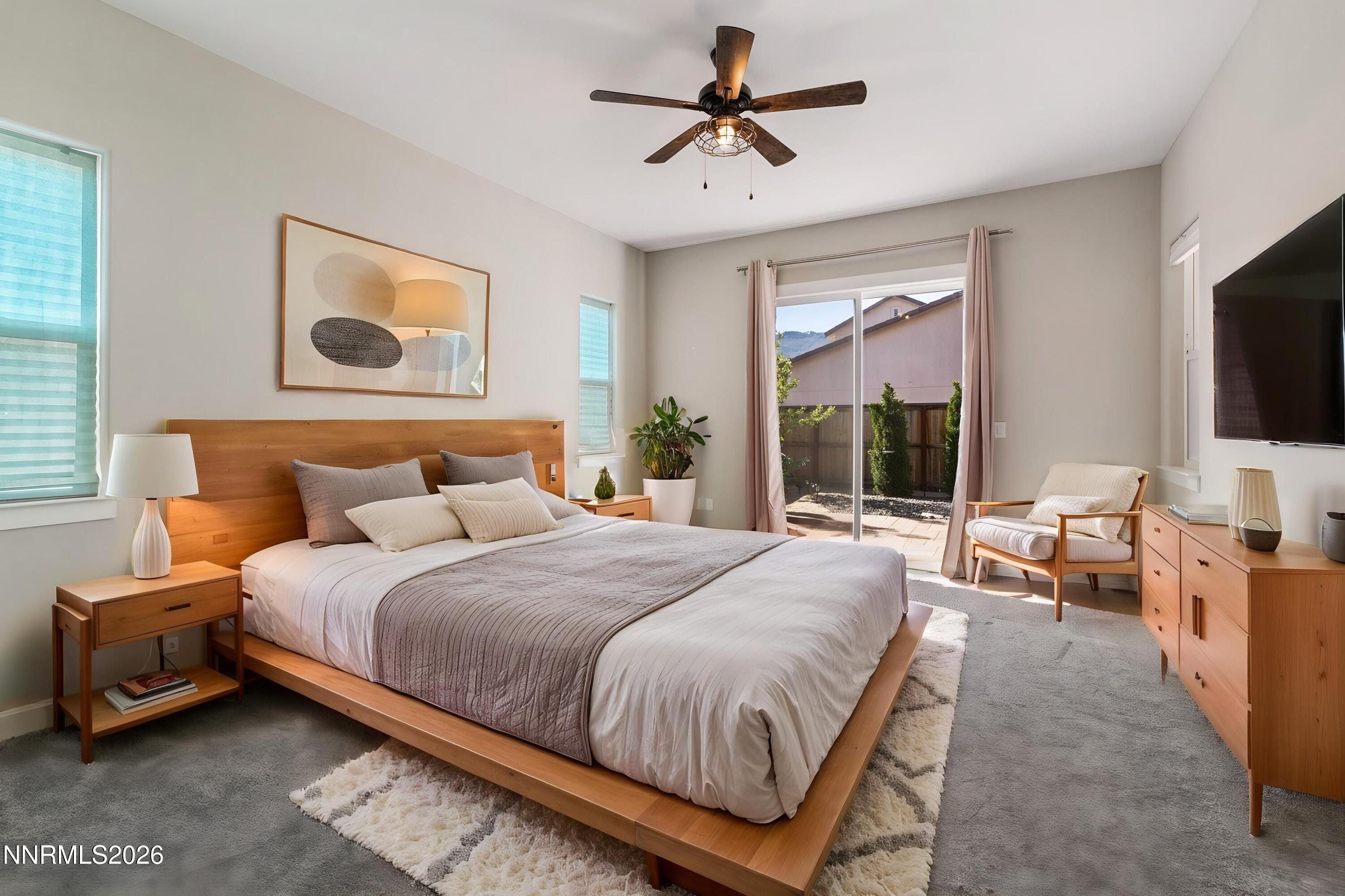 250 Commodore Drive Verdi, NV 89439 - Photo 5 of 49 a bedroom with a bed and glass window