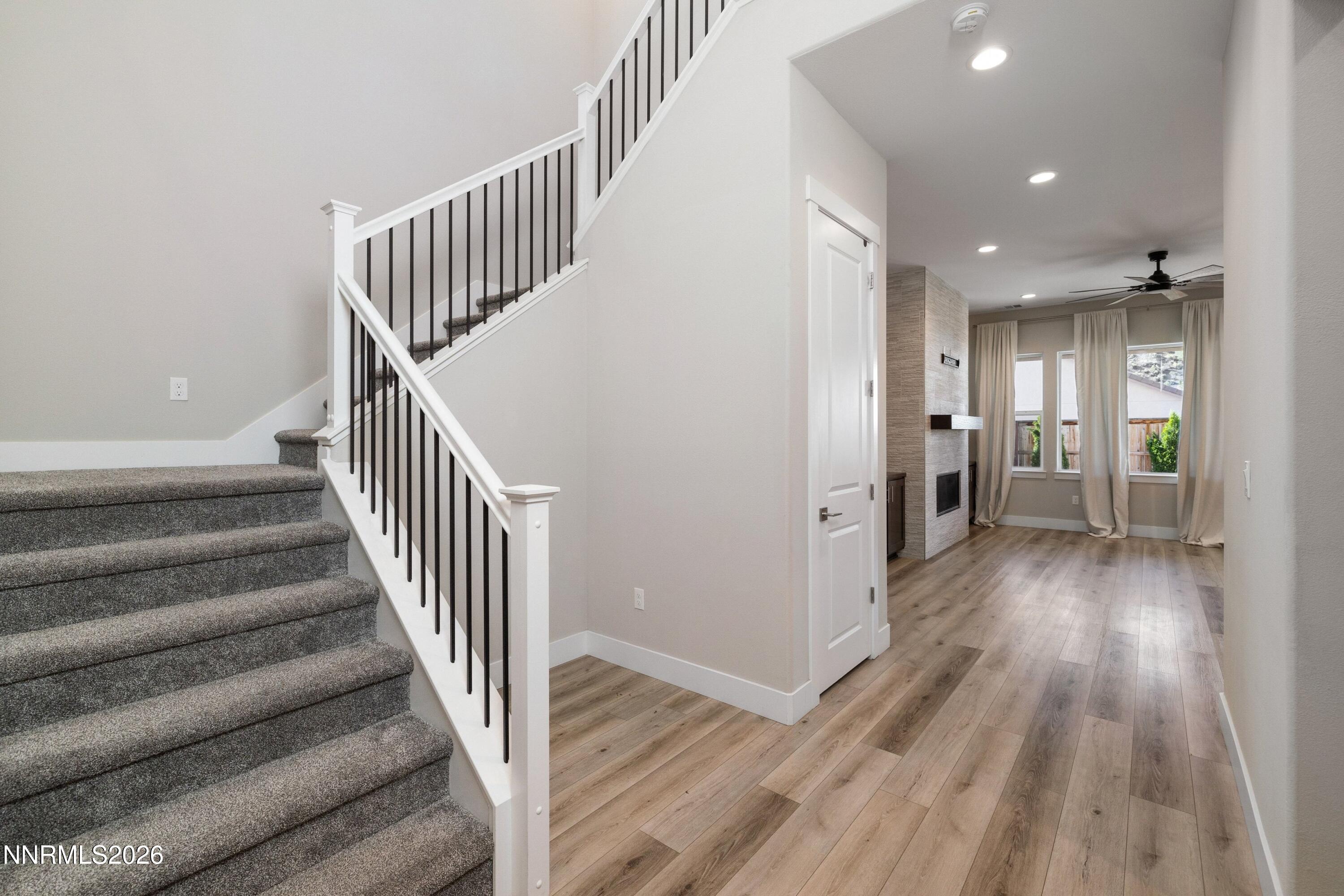 250 Commodore Drive Verdi, NV 89439 - Photo 6 of 49 a view of a hallway with wooden floor and stairs