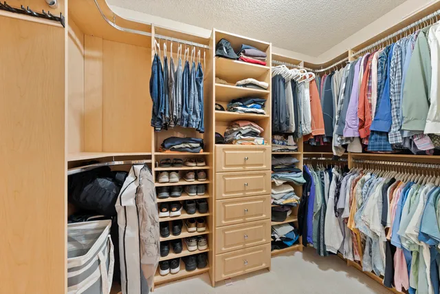 a view of a two chairs in the back yard