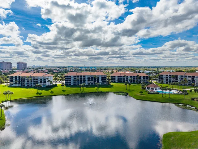 a view of a kitchen with a sink and a refrigerator