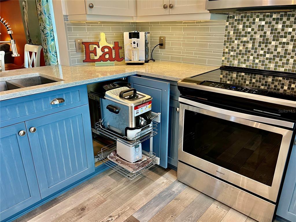 2150 Elm Street, Unit 605 Dunedin, FL 34698 - Photo 11 of 55 a stove top oven sitting inside of a kitchen