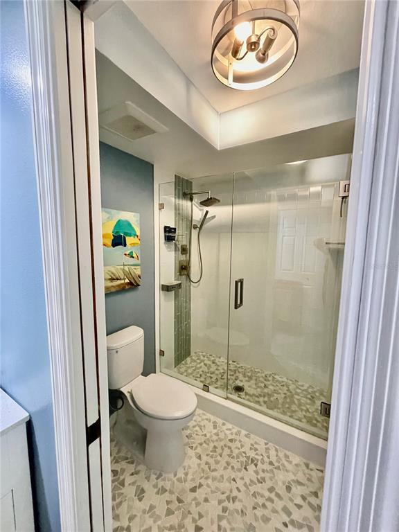 2150 Elm Street, Unit 605 Dunedin, FL 34698 - Photo 28 of 55 a bathroom with a toilet and a shower