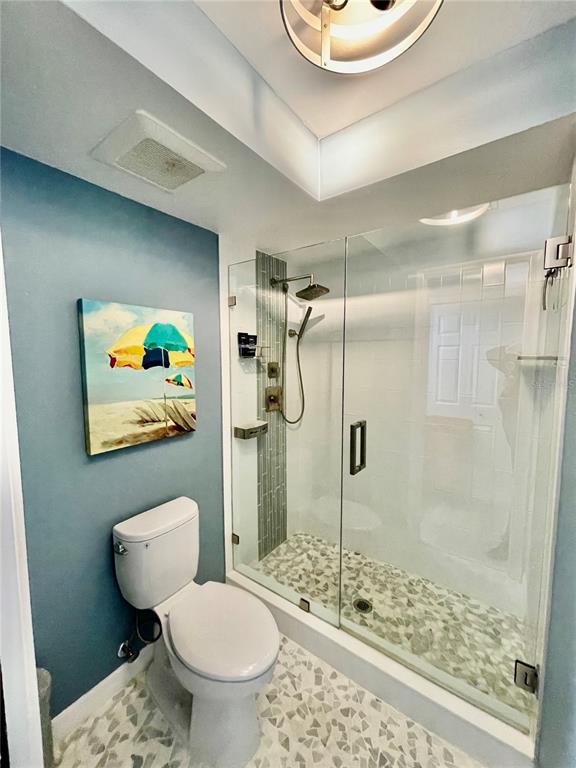 2150 Elm Street, Unit 605 Dunedin, FL 34698 - Photo 29 of 55 a bathroom with a toilet sink and shower