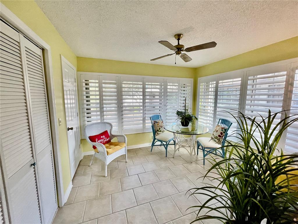 2150 Elm Street, Unit 605 Dunedin, FL 34698 - Photo 40 of 55 a living room with furniture and a large window