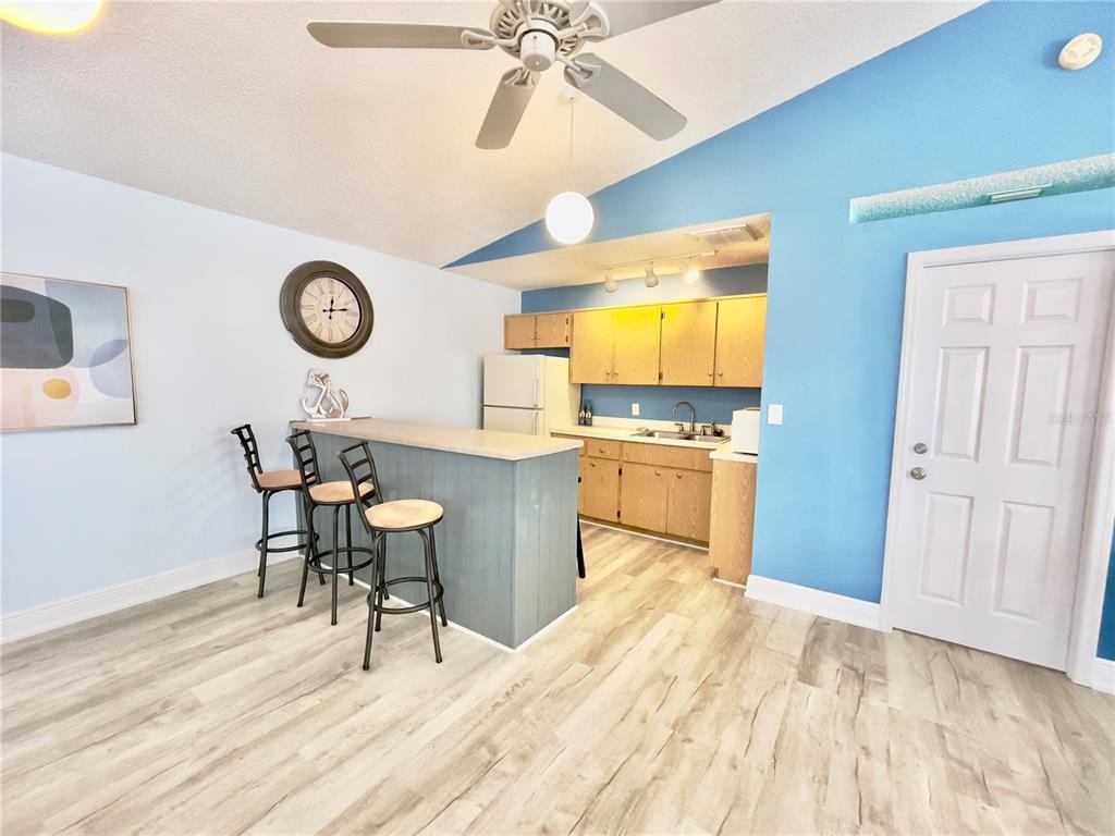 2150 Elm Street, Unit 605 Dunedin, FL 34698 - Photo 46 of 55 a kitchen with a table and chairs