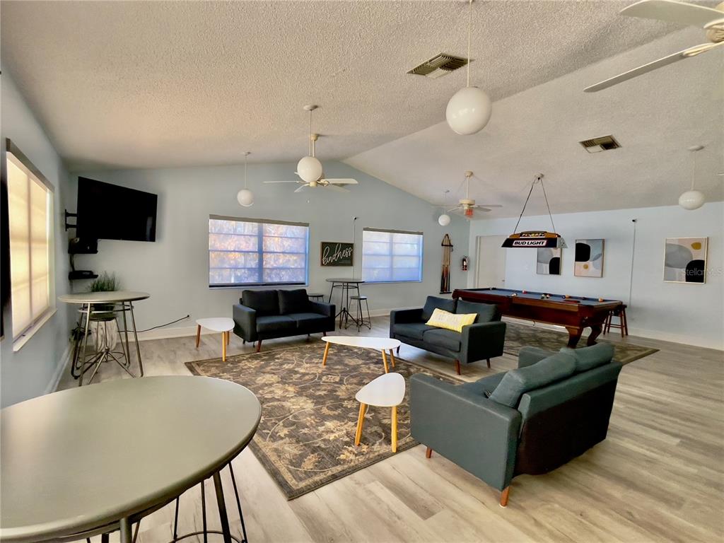 2150 Elm Street, Unit 605 Dunedin, FL 34698 - Photo 47 of 55 a living room with furniture and a flat screen tv