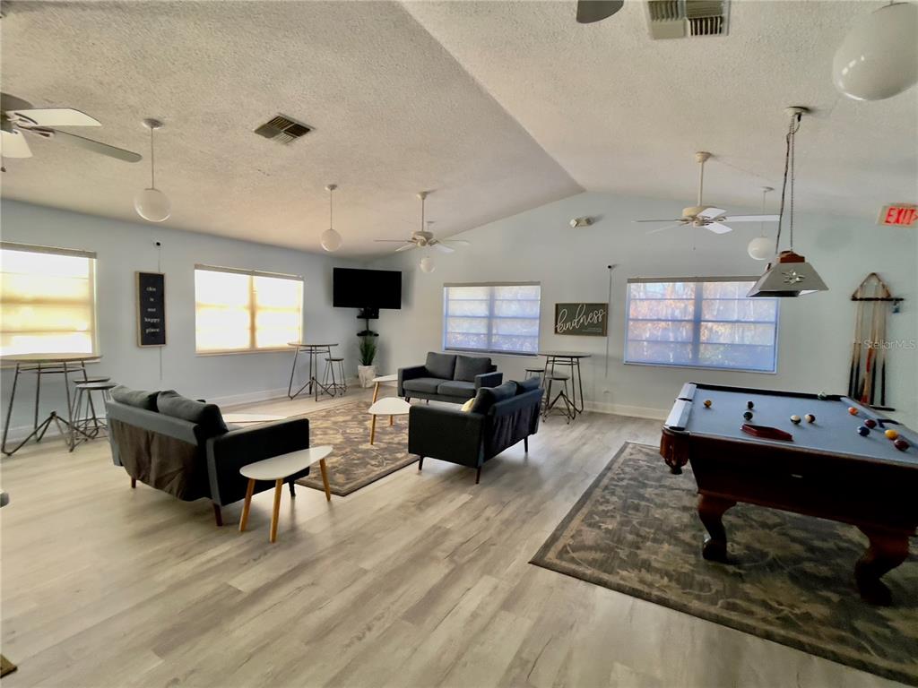 2150 Elm Street, Unit 605 Dunedin, FL 34698 - Photo 49 of 55 a living room with furniture and wooden floor