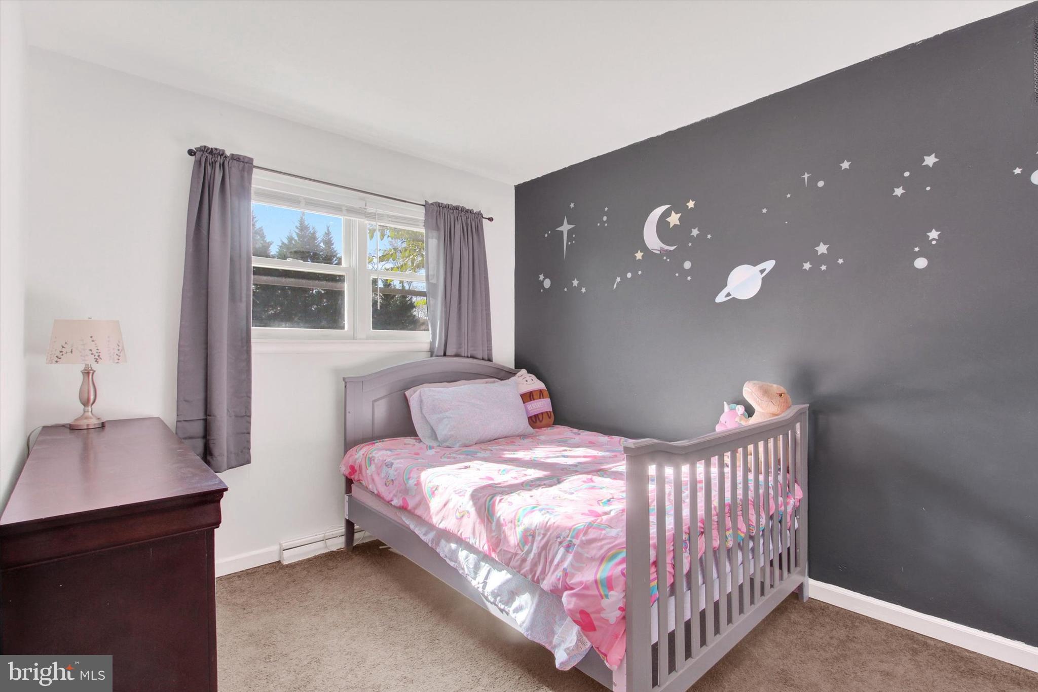 1365 Hanover Road Gettysburg, PA 17325 - Photo 17 of 26 a bedroom with a bed and a table in it