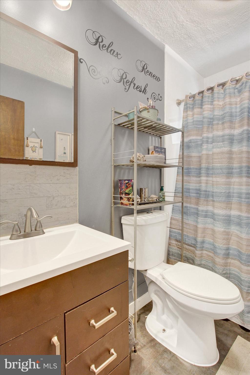 1365 Hanover Road Gettysburg, PA 17325 - Photo 19 of 26 a bathroom with a sink a toilet and shower