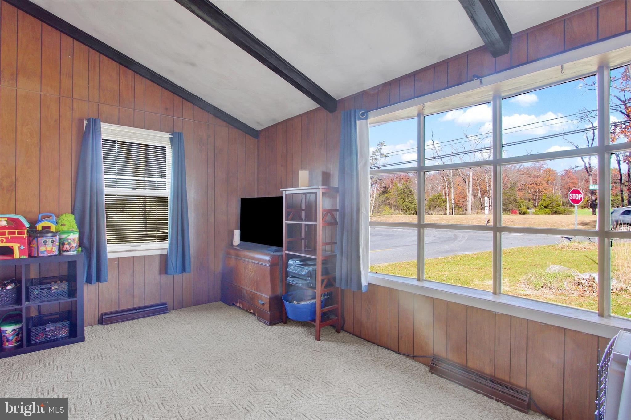 1365 Hanover Road Gettysburg, PA 17325 - Photo 20 of 26 a living room with furniture and a flat screen tv