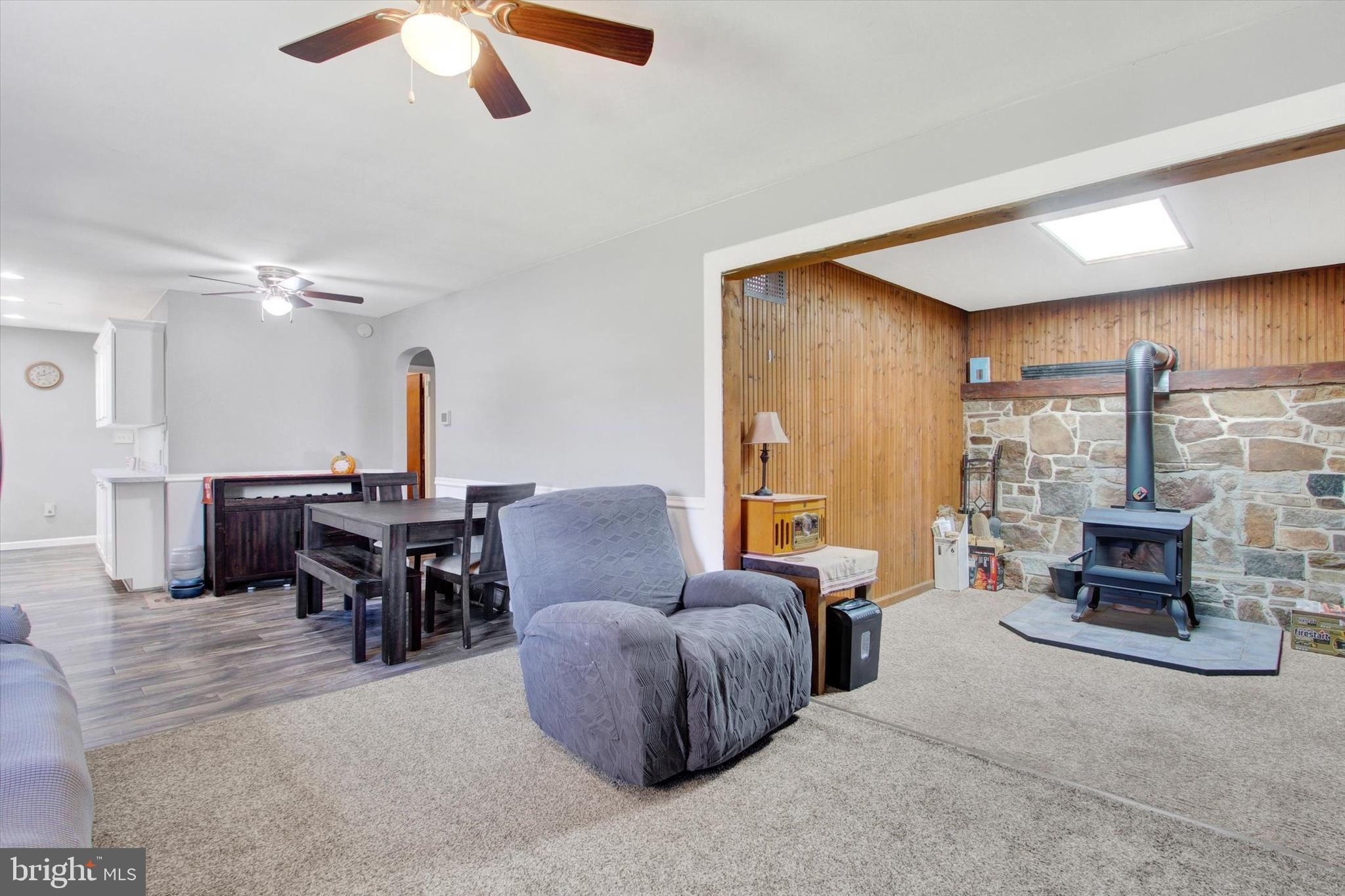 1365 Hanover Road Gettysburg, PA 17325 - Photo 7 of 26 a living room with furniture a fireplace and a large window
