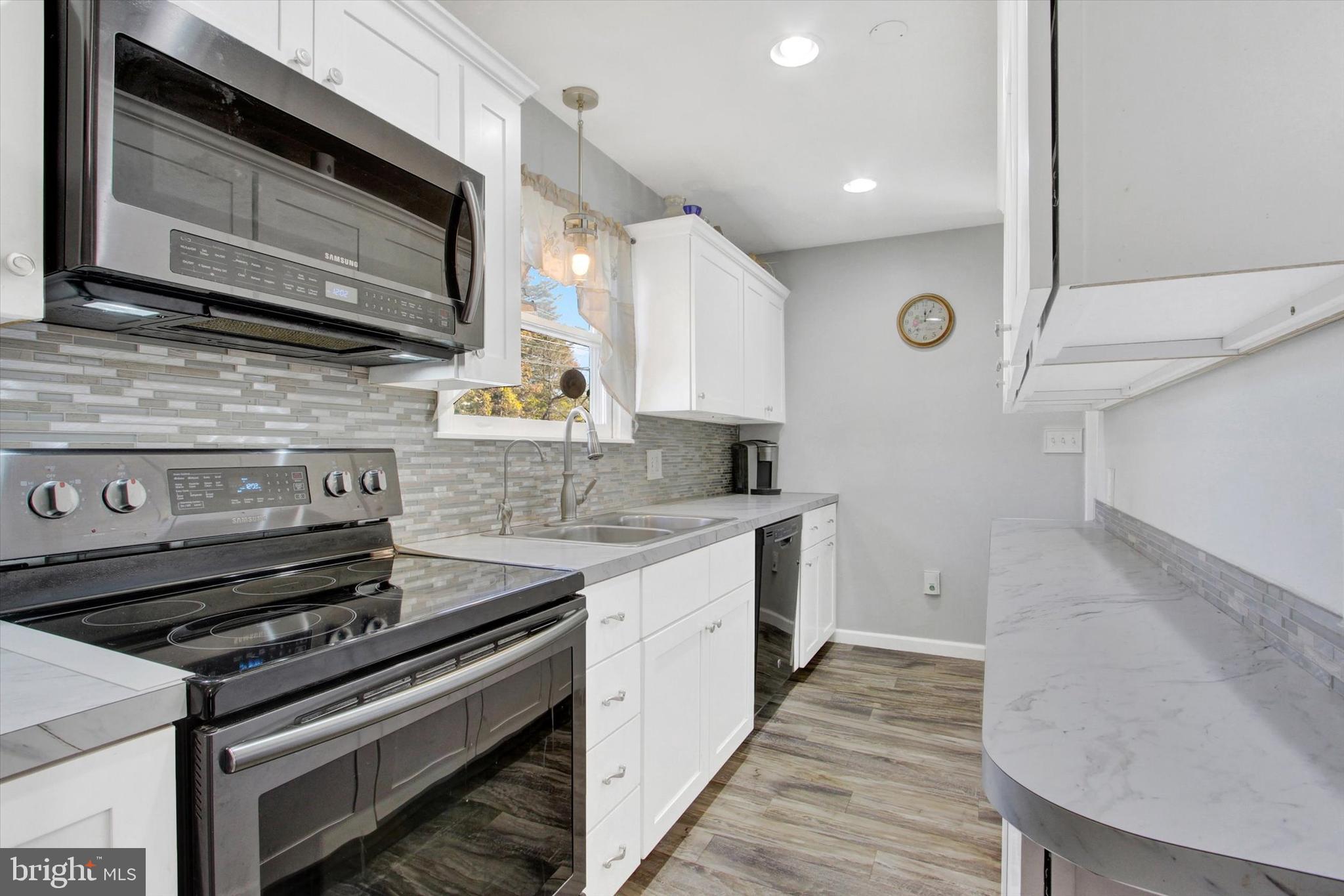 1365 Hanover Road Gettysburg, PA 17325 - Photo 9 of 26 a kitchen with a stove and a microwave