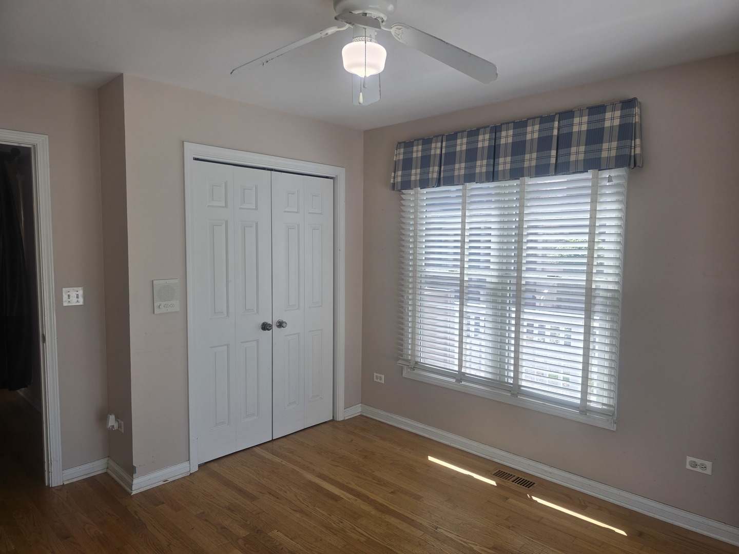 312 Nuttall Road Riverside, IL 60546 - Photo 12 of 35 a view of an empty room with wooden floor and a window