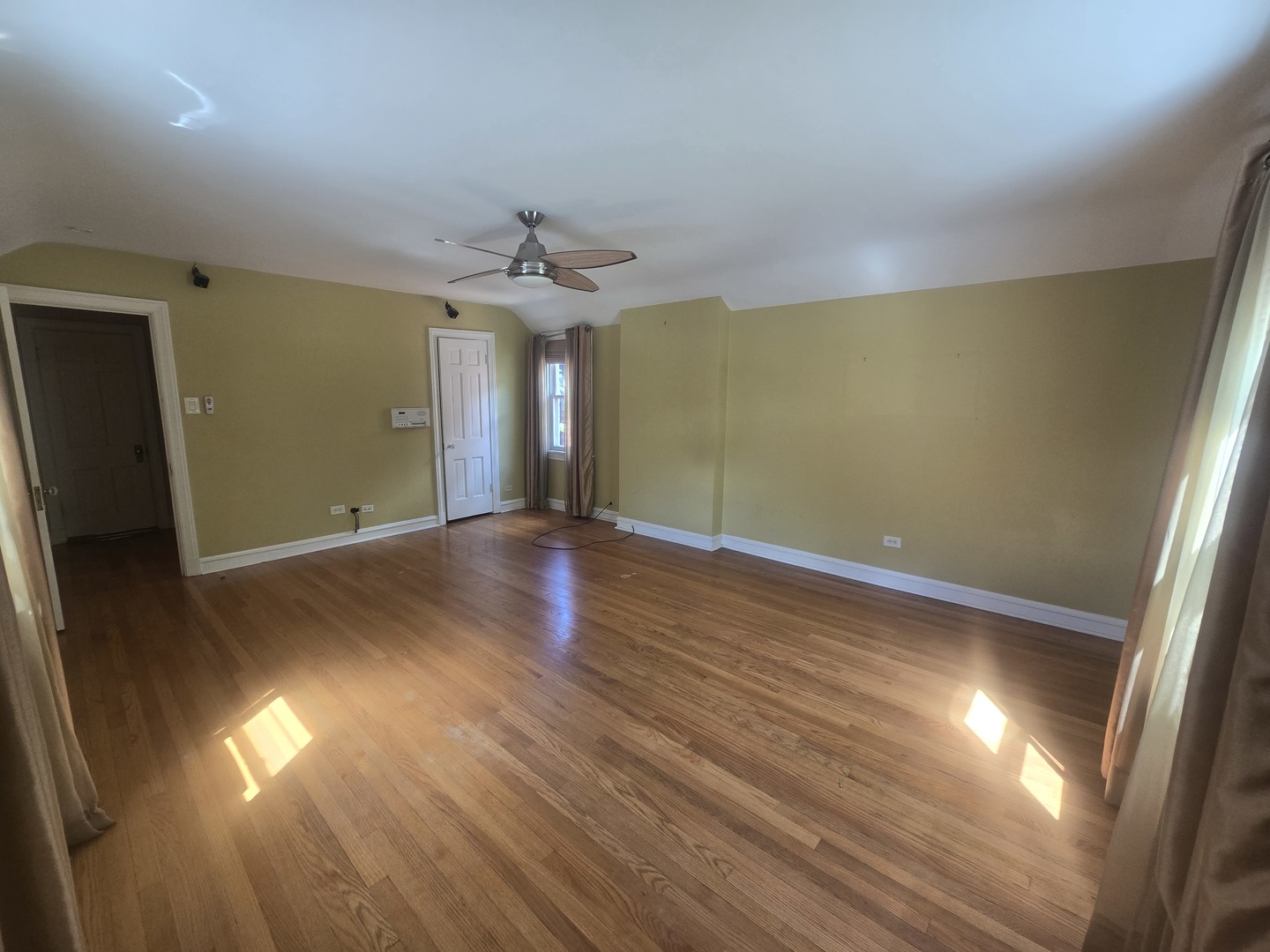 312 Nuttall Road Riverside, IL 60546 - Photo 17 of 35 an empty room with wooden floor and windows
