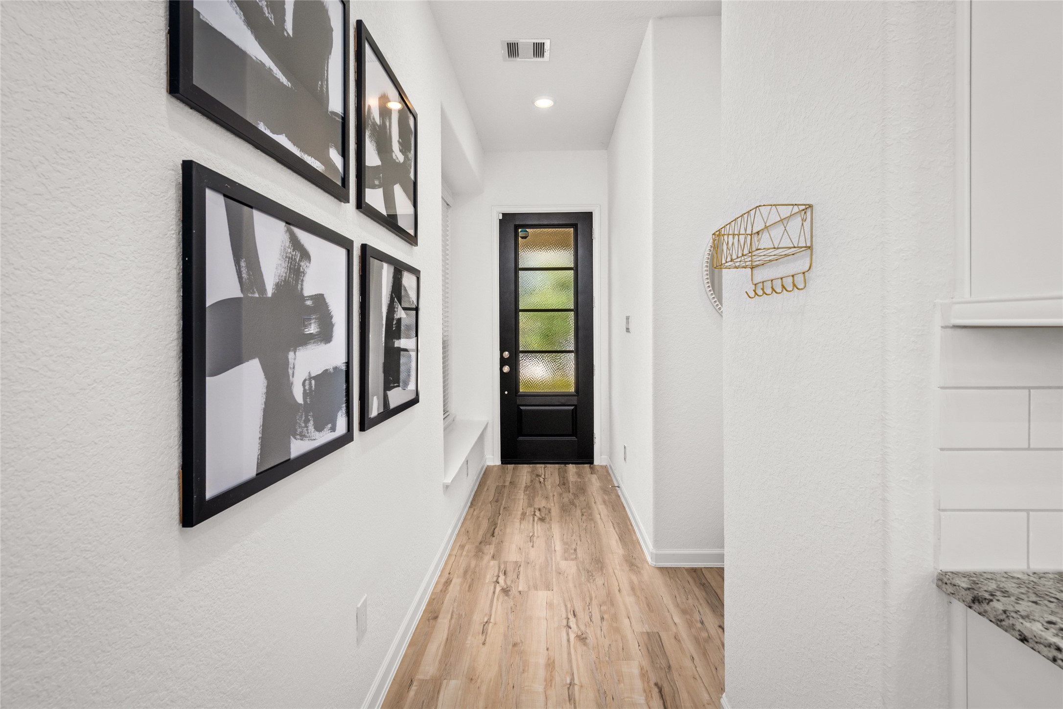 575 Dry Fork Lane Conroe, TX 77304 - Photo 23 of 34 Modern front foyer highlighted by a contemporary front door and cozy window seating.