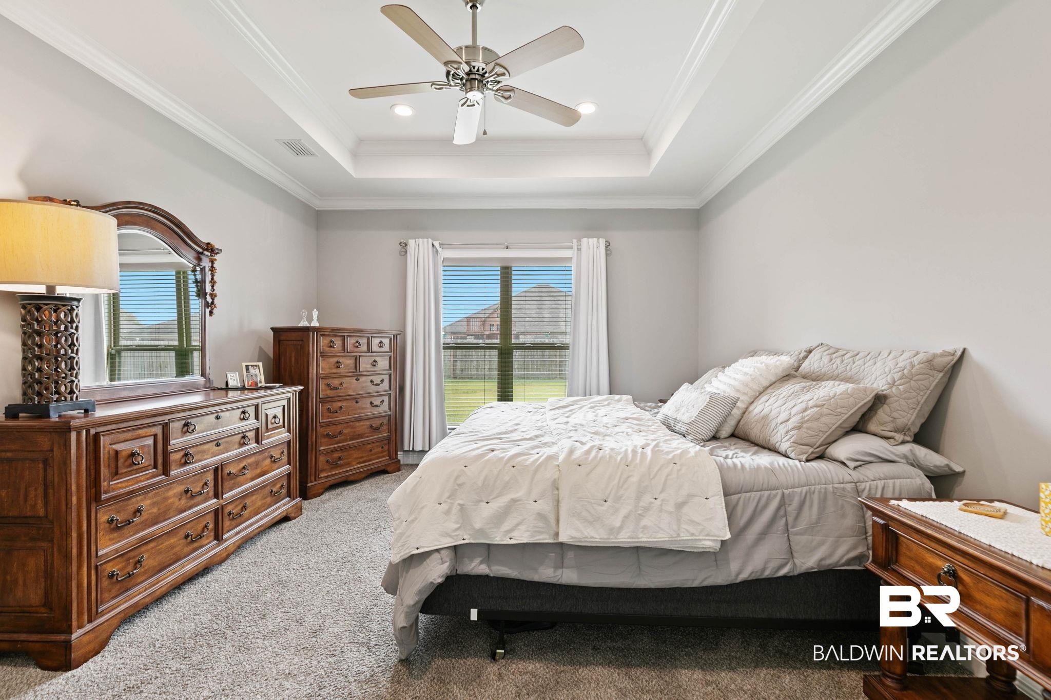 9388 Pembrook Loop Fairhope, AL 36532 - Photo 33 of 53 Carpeted bedroom featuring ornamental molding, a ceiling fan, a raised ceiling, and recessed lighting