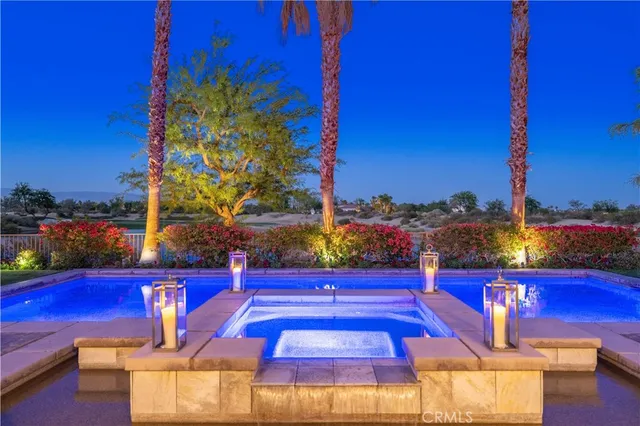 a view of a pool with a yard