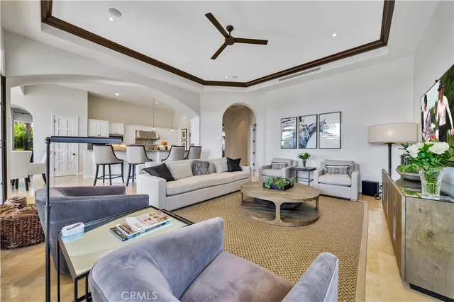 a living room with furniture or kitchen and a chandelier