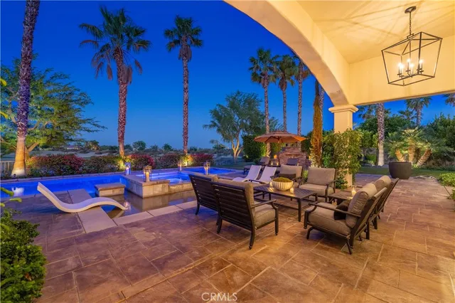 a backyard of a house with outdoor seating