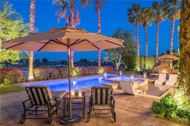 a view of a backyard with sitting area and furniture