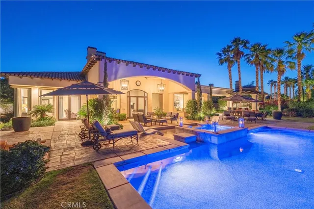 a view of swimming pool with outdoor seating