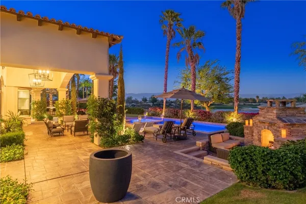 a view of a chair and tables in the patio