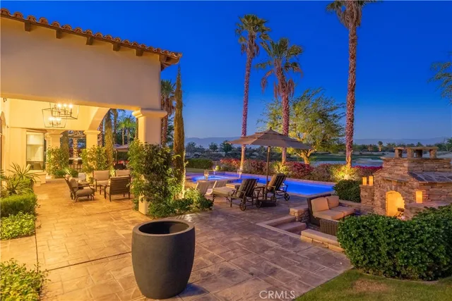 a view of a chair and tables in the patio