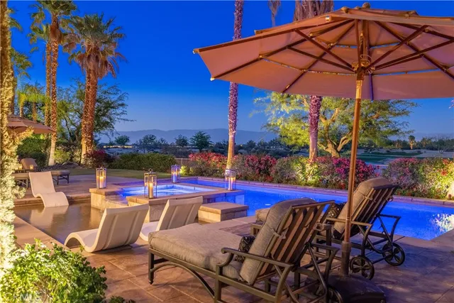 a view of a swimming pool with a patio